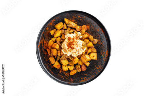 Patatas Bravas, traditional Spanish tapas, baked potato with spicy tomato sauce.  Isolated, transparent background. © Vladimir