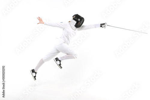 Female fencer practicing with a sword on a white background © o_lypa