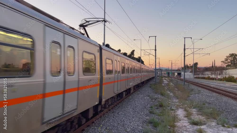 Athens subway train arriving at Pallini station at dawn Athens subway train arriving at Pallini station at dawn