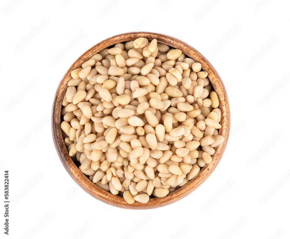 Top view of shelled pine nuts in a wooden bowl.