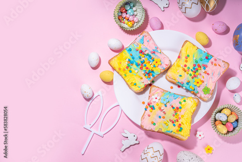 Cute sweet and funny Easter breakfast for kids. Homemade rainbow colored sandwiches, sandwiches with colored cream cheese and sugar sprinkles