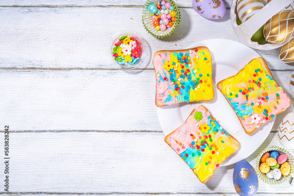 Cute sweet and funny Easter breakfast for kids. Homemade rainbow colored sandwiches, sandwiches with colored cream cheese and sugar sprinkles