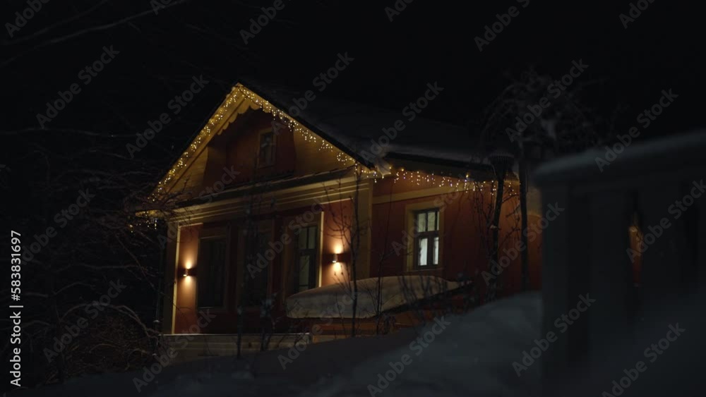 old wooden house is decorated for xmas. night before christmas old wooden house is decorated for xmas. night before christmas
