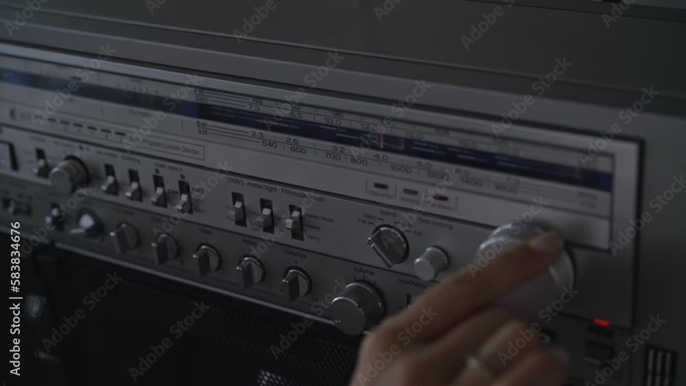 girl turns up the volume on a retro tape recorder girl turns up the volume on a retro tape recorder