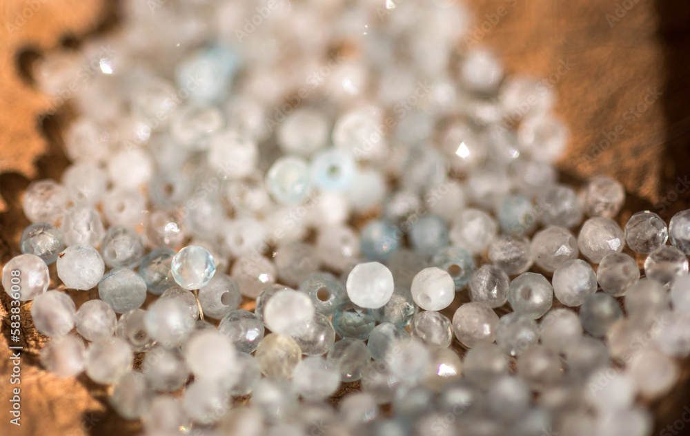 Φωτογραφία The photo with aquamarine stones is made on the background of a wooden board and dried hydrangea