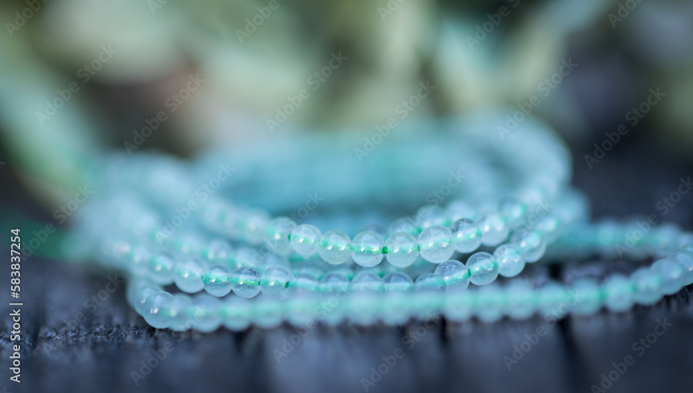 Φωτογραφία The photo with blue aventurine stones is made on the background of a wooden board and dried hydrangea