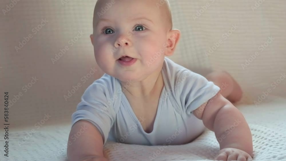 Closeup portrait of Newborn baby on white blanket. Soft focus. Infant ...