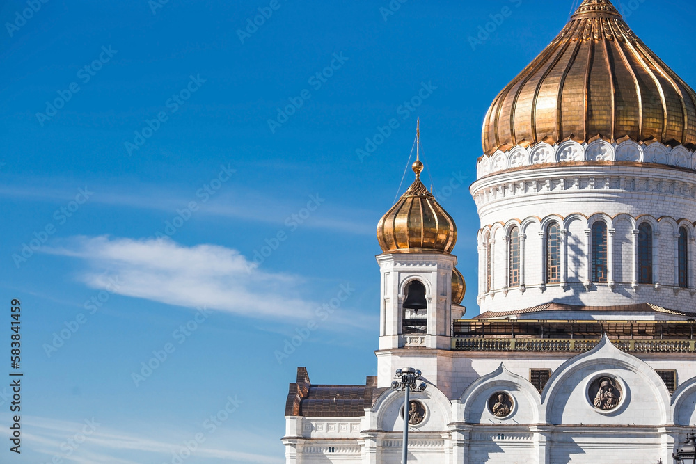Fototapeta premium Russian Orthodox Cathedral - The Cathedral of Christ the Savior in Moscow against the blue sky on a sunny spring day. Russian Federation, Moscow.