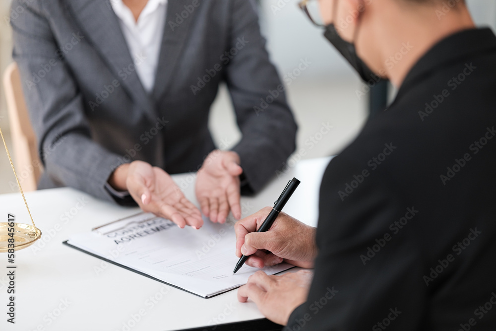 Lawyer office. Statue of Justice with scales and lawyer working on a laptop. Legal law, advice and justice concept. Lawyer office. Statue of Justice with scales and lawyer working on a laptop. Legal law, advice and justice concept.