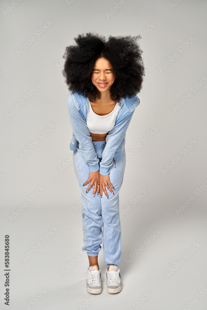 Funny beautiful african american girl with an afro hairstyle wear blue velour tracksuit Funny beautiful african american girl with an afro hairstyle wear blue velour tracksuit
