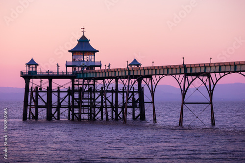View of old Victorian ocean pier in Clevedon, Somerset, England at sunset photo