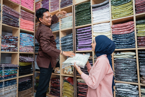 muslim worker preparing product stock for shipping from the shop warehouse