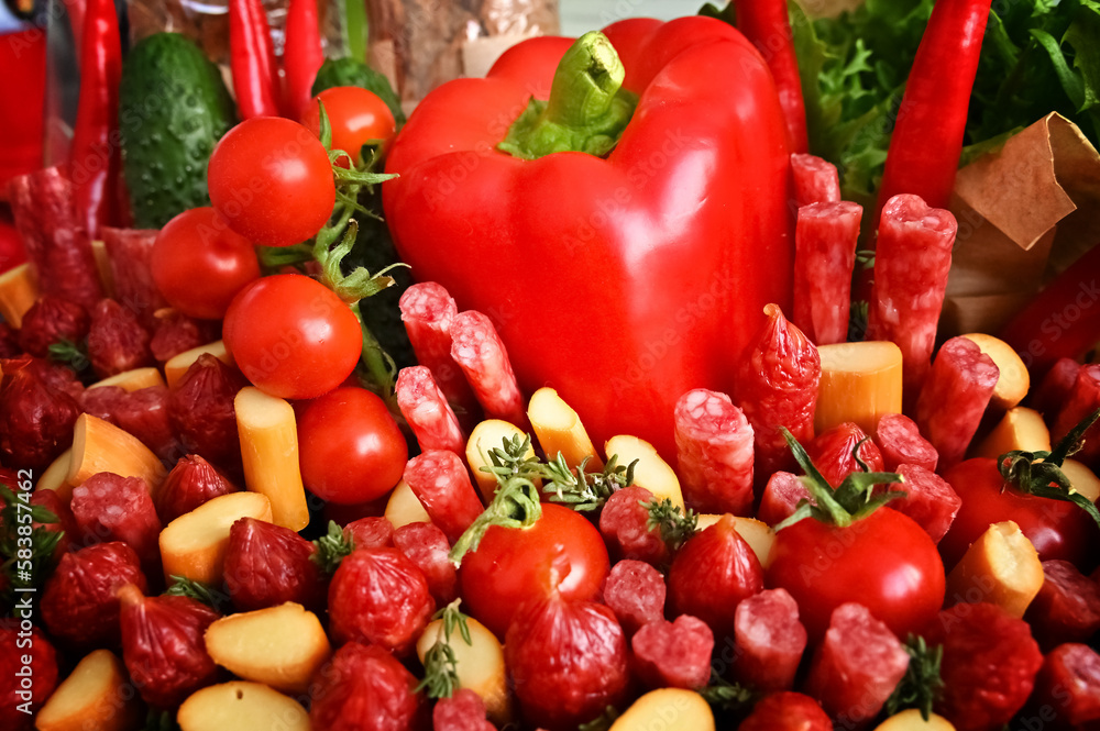 A set of products such as sausage, cheese, bread and tomatoes