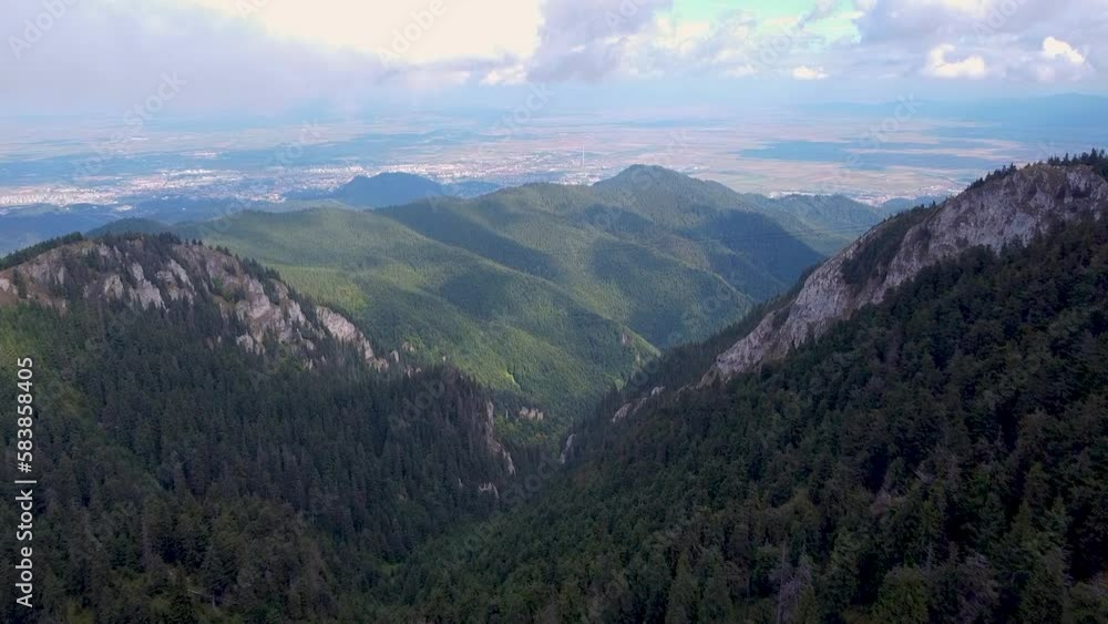 A Stunning Aerial View Of A Lush Mountain Forest Shrouded in Thick White Clouds, Located in Poiana Brasov, Romania A Stunning Aerial View Of A Lush Mountain Forest Shrouded in Thick White Clouds, Located in Poiana Brasov, Romania
