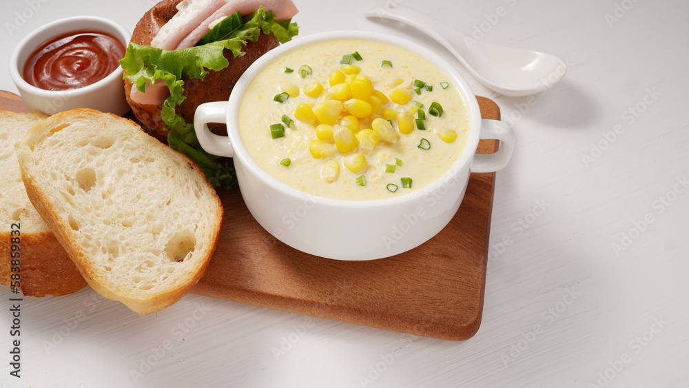 Corn Soup and Bread breakfast menu on white table Corn Soup and Bread breakfast menu on white table
