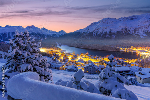 Fairy tale view of Saint Moritz on a snowy winter dusk, Engadine, Graubunden canton, Switzerland photo