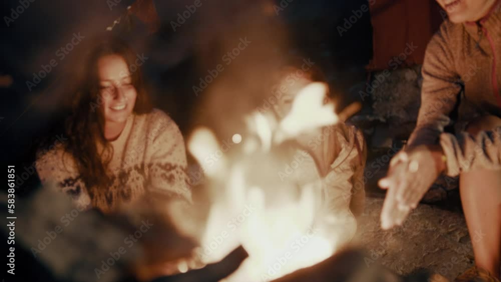 three friends at the fire