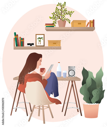 Girl with a laptop works or play while sitting in a chair in her cosy house with plants, the, coffè, books.