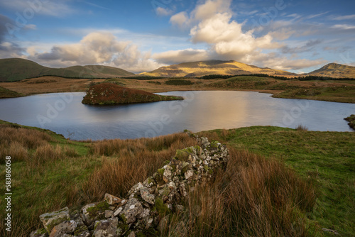 A view across the lake to Mount Snowdon at Llyn Y Dywarchen in the Snowdonia National Park, Wales photo