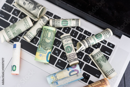 Money on computer keyboard. roll © Angelov