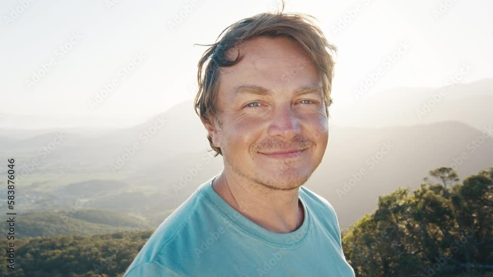 Portrait of the young happy smiling man. Young caucasian man outdoor at sunrise Portrait of the young happy smiling man. Young caucasian man outdoor at sunrise