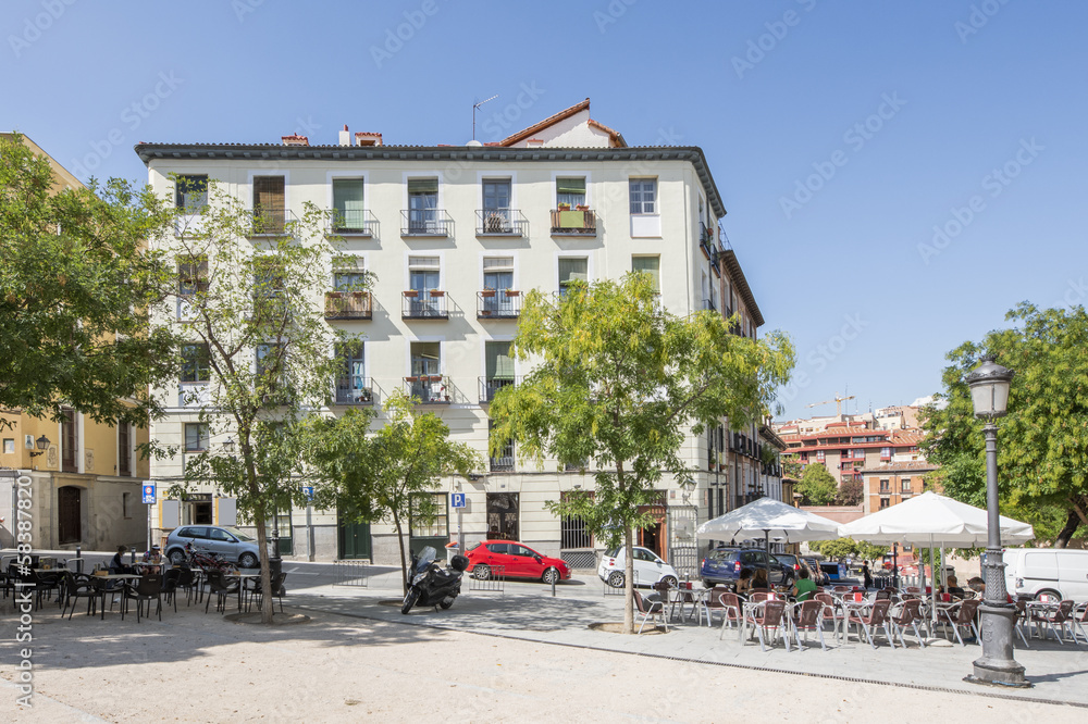 A square in the historic center of Madrid with bar terraces set up with umbrellas
