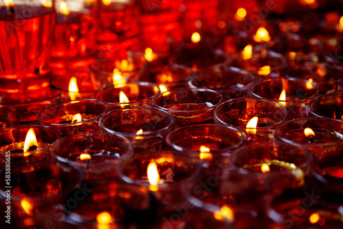 Wallpaper Mural Close-up photo of a lot of red candles in glasses burning in a Chinese Taoist shrine at night. The flames of the candles create a sacred atmosphere  Torontodigital.ca