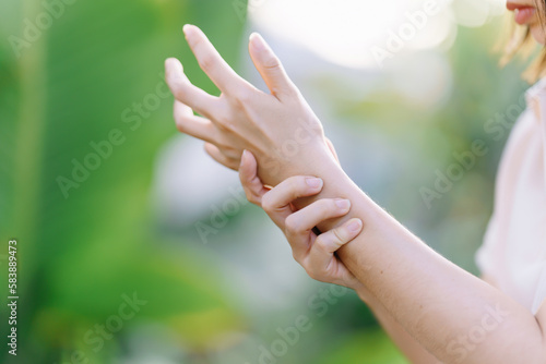 Woman having wrist pain due to carpal tunnel syndrome. Health care concept. © Oporty786