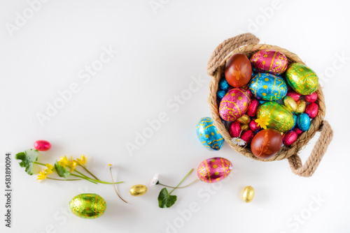 Canvas Print Easter eggs in basket with white background on white table