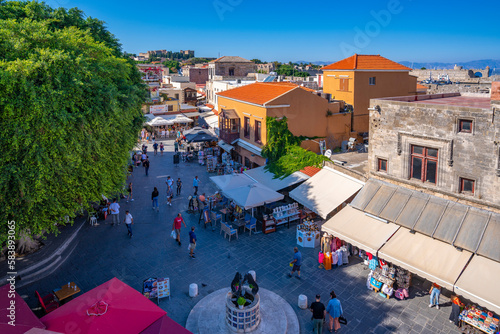 View of shops and cafes in Evreon Martyron (Jewish Martyrs Square), City of Rhodes, Rhodes, Dodecanese Islands, Greek Islands