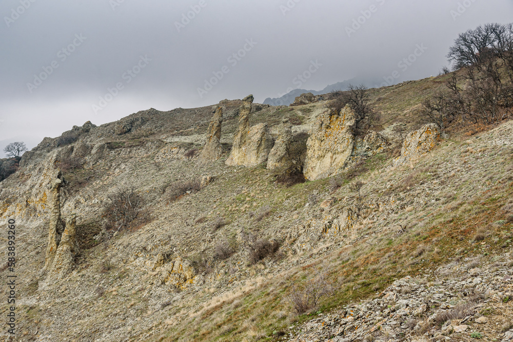 Gingerbread horse rock and bizarre rocks in Dead city. Khoba-Tele Ridge of Karadag Reserve in spring. Crimea