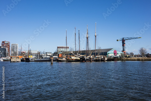 Panoramic view from the IJ river to NDSM neighborhood (Amsterdam-Noord borough), located on the former terrain NDSM-wharf, along the IJ river. AMSTERDAM, The NETHERLANDS. © dbrnjhrj