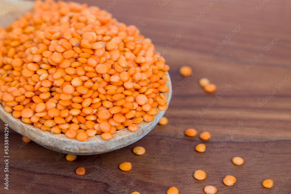 red lentils in a wooden bowl red lentils in a wooden bowl