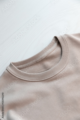 MOKITUP: Lifestyle Isolated Closeup Crewneck Sweatshirt Collar Mockup Against Woodgrain