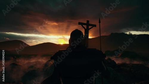 Jesus Christ is crucified on a wooden cross on Golgotha ​​under the protection of a Roman legionnaire against the backdrop of an epic sky with thunderclouds through which the rays of the setting sun b