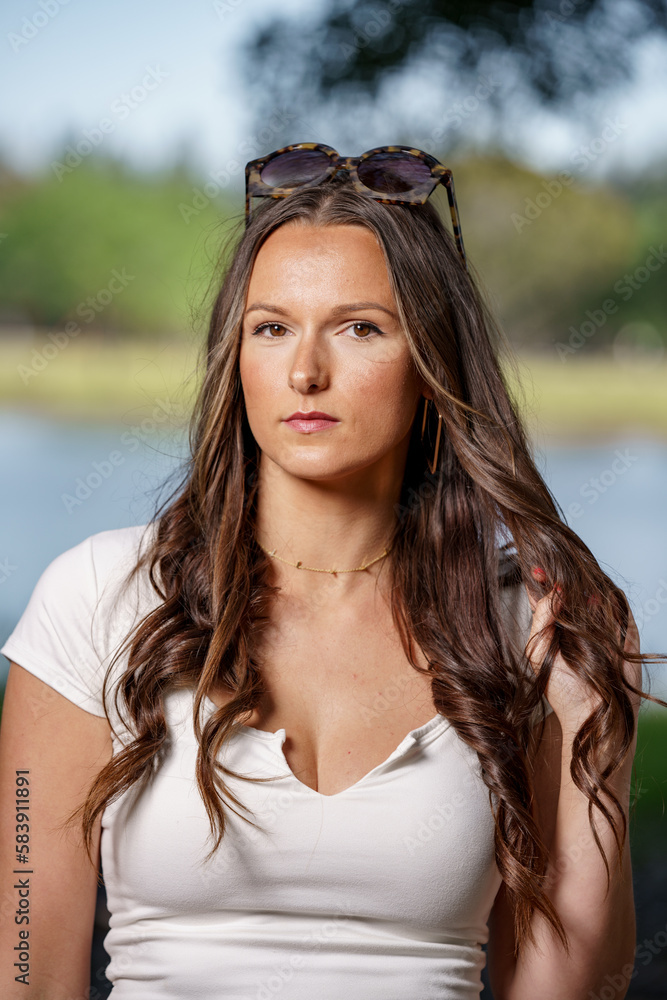 Photo of an attractive young woman deadpan expression at camera Photo of an attractive young woman deadpan expression at camera