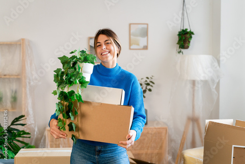 Positive young female in casual clothes smiling and looking at camera 