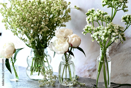 Fresh white gypsophila, piones on a white background. Wedding date. An invitation to a holiday. Congratulation.An empty space for text. View from above. photo