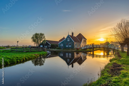 Sunrise at Zaanse Schans village with Dutch traditional house near Amsterdam Netherlands