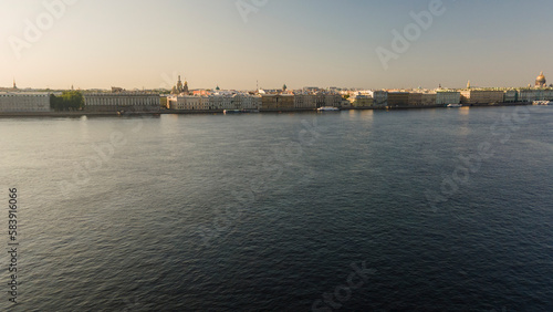 Aerial view above water of the Peter-Pavel's Fortress next to bridges on the river and water channel in the historical centre of city of St. Petersburg at sunny summer morning