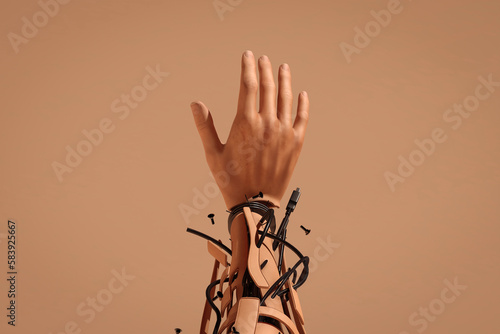 Robotic human arm broken into pieces photo