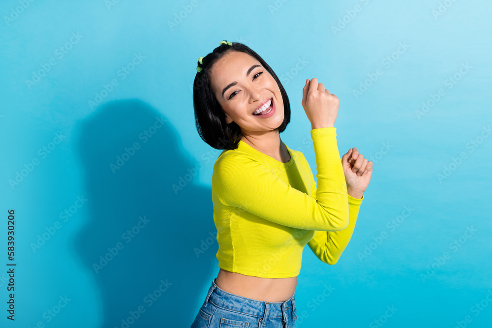 Profile photo of cheerful overjoyed indonesian girl chilling dancing isolated on blue color background Profile photo of cheerful overjoyed indonesian girl chilling dancing isolated on blue color background
