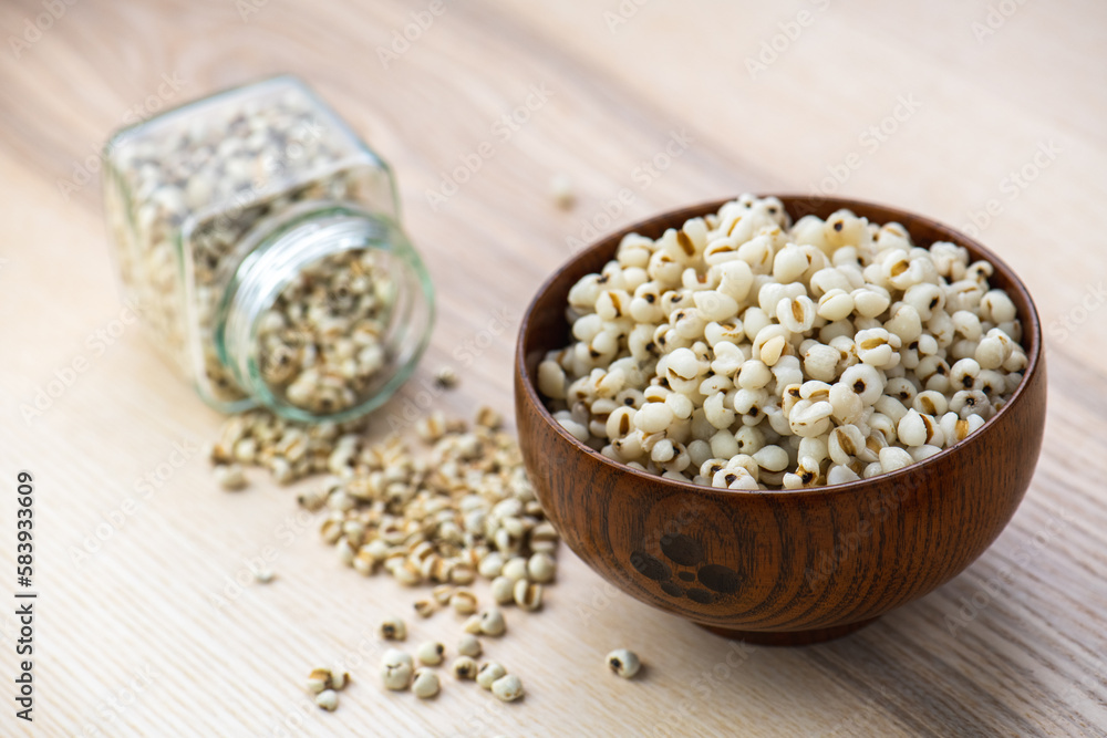 Hot Boiled Job’s Tears millet seed from boiler. White boiled Job’s Tears is highly nutritious cereal healthy fresh organic in salad dish.