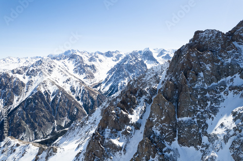 Aerial shot of stunning snow covered mountain range