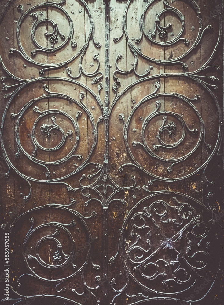 Closeup shot of beautifully ornate metal scrollwork on a door at York Minster