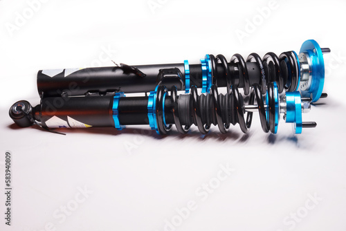 auto suspension tuning coilovers shock absorbers and springs blue for a sports drift car on a dark background