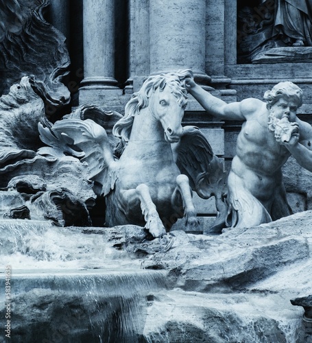 Cherub and winged water horse statues emerging from the Trevi Fountain in Rome, Italy