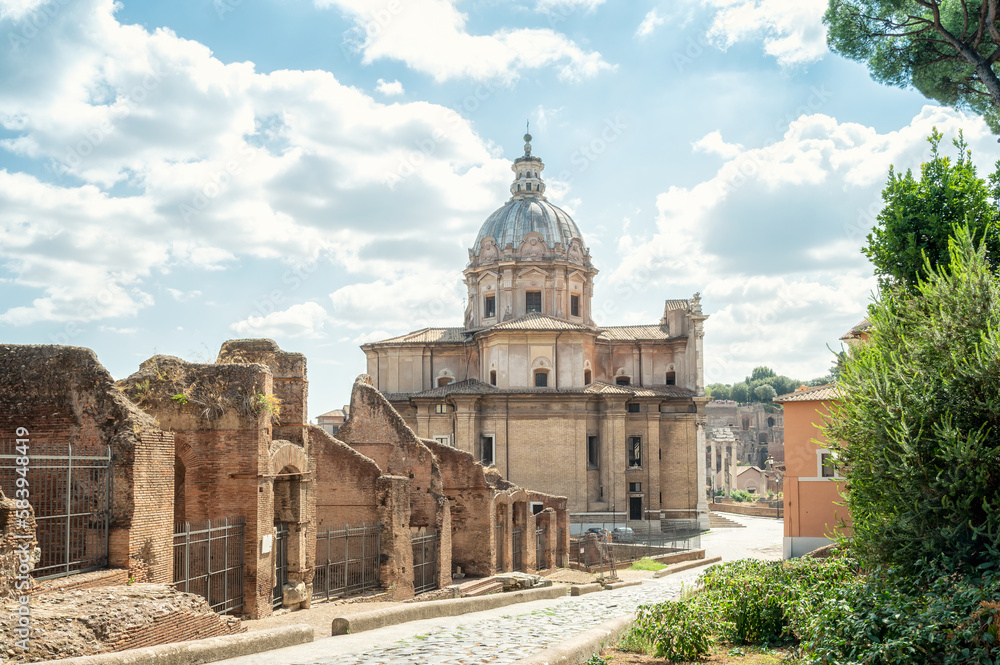 Amazing view of the Church of Saints Luca and Martina among the ruins of the famous Roman Forum (Foro Romano) on a sunny day in Rome, Italy