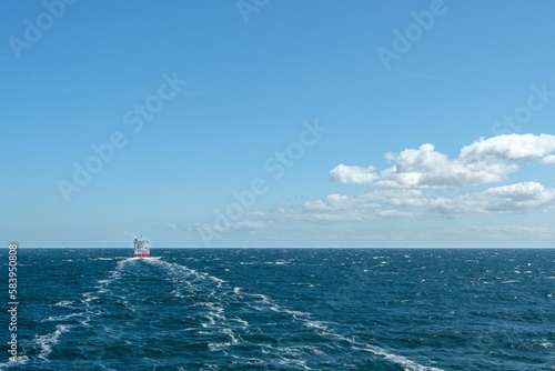 Ship sailing in the Baltic sea at daytime in summer in Rodby, Denmark