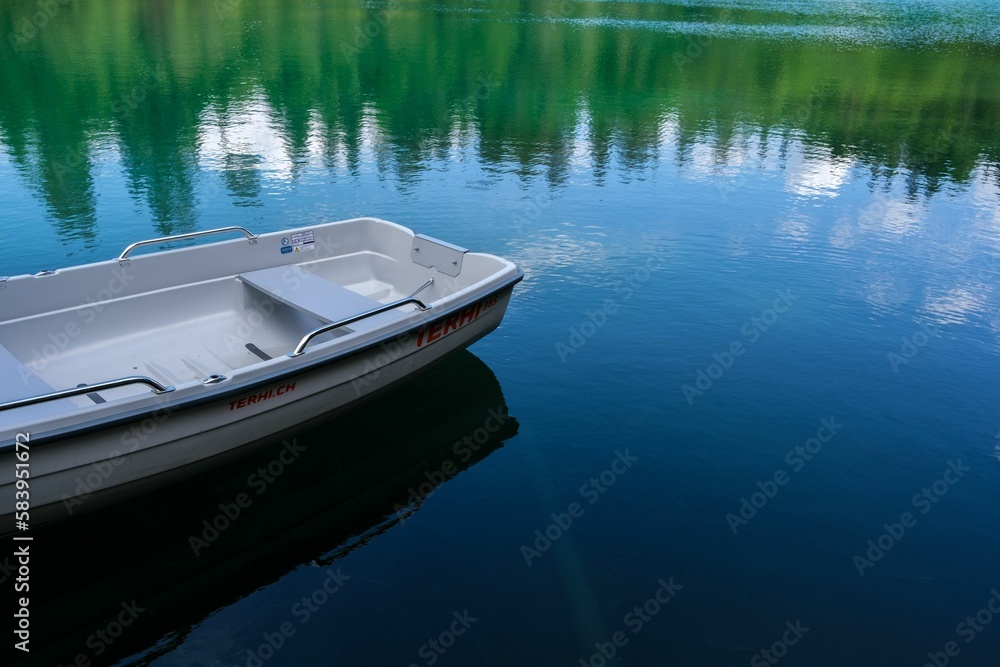 Boat in a lake in the Grisons Mountains in Switzerland